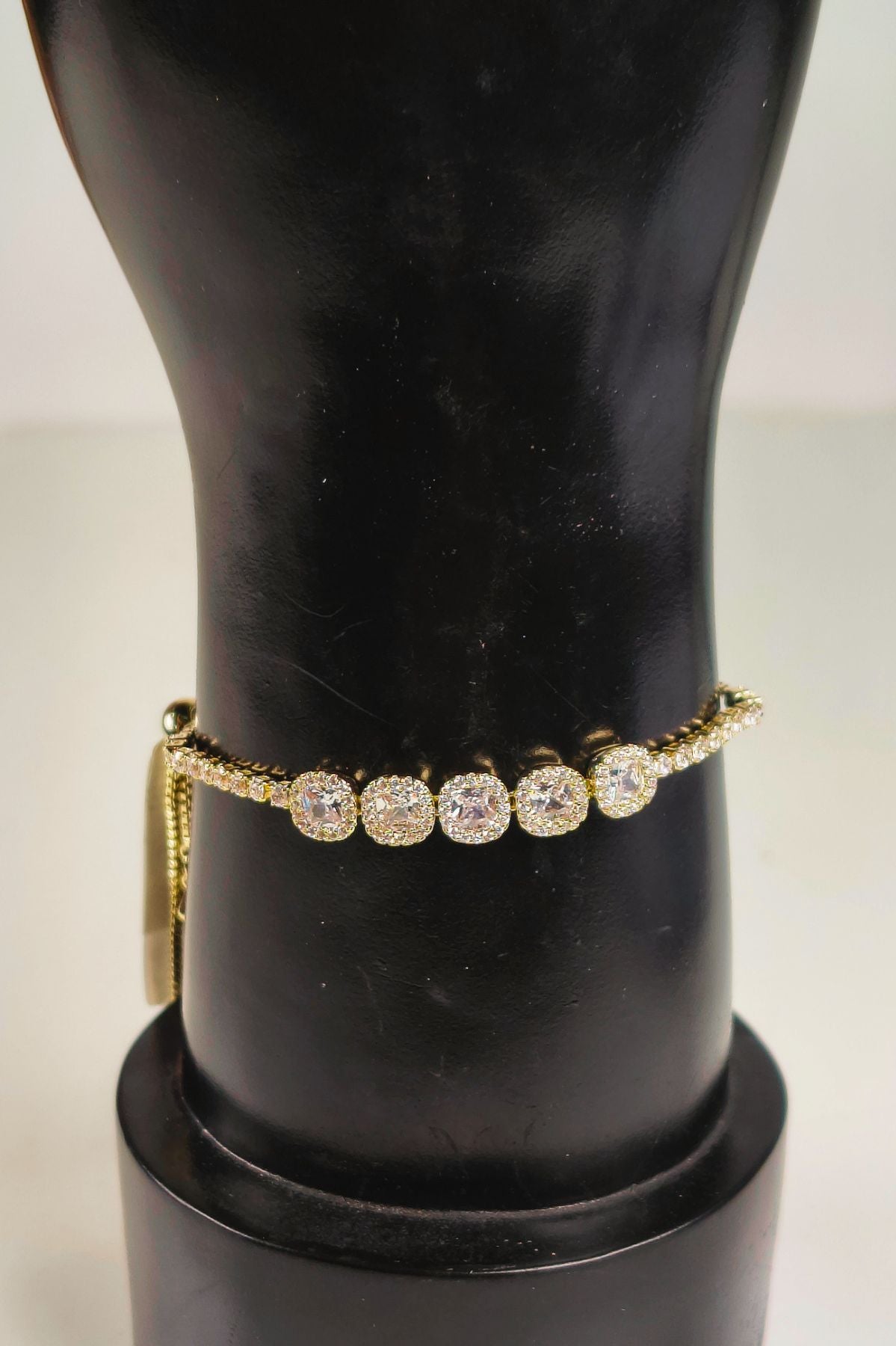 Gold-Plated Oval-Cut Diamond-Studded Tennis Bracelet.