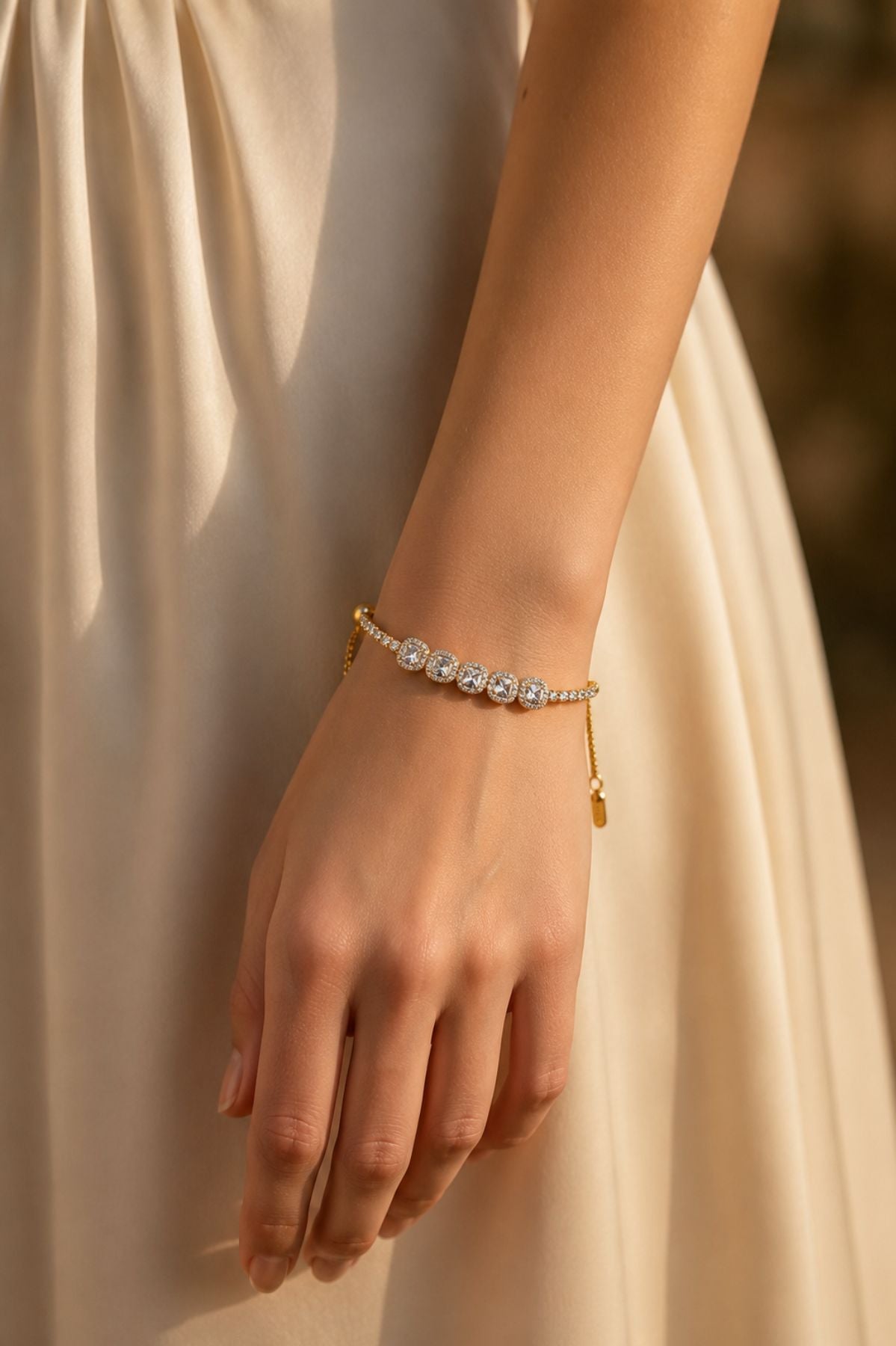 Gold-Plated Oval-Cut Diamond-Studded Tennis Bracelet.